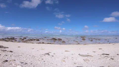 Real time still view of sandy rocky white beach view of Koromiri islet look out  Stock Footage 250401980