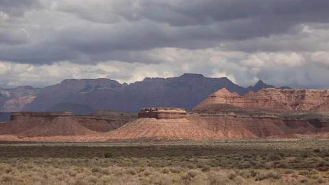 Real time of summer rain cloud shadows on a distant Zion National Park Stock Footage 217585990