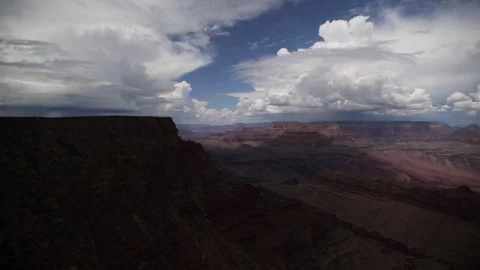 Real Time of summer rain storms forming in blue sky over the Grand Canyon 스톡 동영상 247532920
