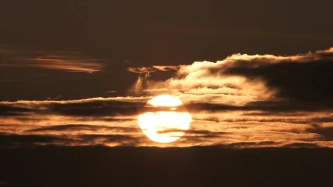 Real Time Sun Rising Through Dark Clouds Stock Footage 112621999