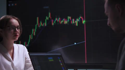 A real-time trader and his colleague trade on the stock market in their Stock Footage 317165829