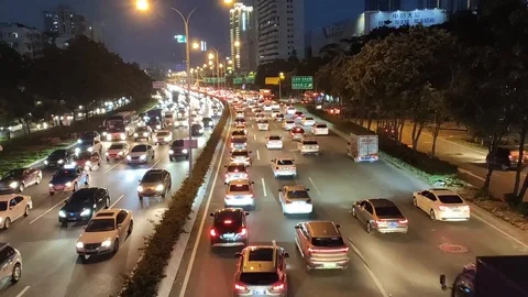 Real-time-traffic-flow-at-night-peak Stock Footage 126229567
