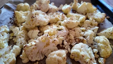 Real time video of cauliflower florets baking in the oven Stock Footage 327651908