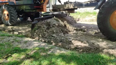 Real time video as grader is working on the rural road Stock Footage 275184567