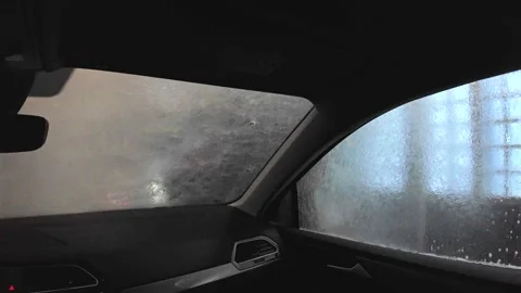Real time video inside a car during an automated car wash, capturing the Stock Footage 333536779
