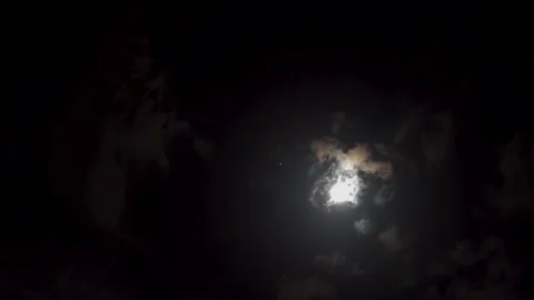 Real time video of moving clouds in the midnight in the glowing moonlight. Stock Footage 136213740