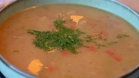 Real time video of steaming hot bowl of golden chanterelle mushroom soup in.. Stock Footage 327392290