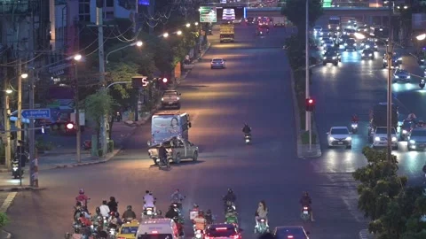 Real time view of a Busy Intersection In Bangkok At Dusk. Stock Footage 239607790