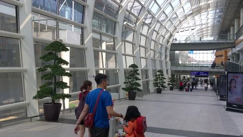 Real time view of Passengers arrive at Hong Kong International Airport Stock Footage