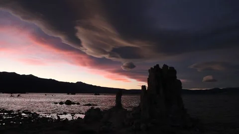 Real time view of pink lenticular clouds over ancient tufa towers at Mono Lake Stock Footage 130219720