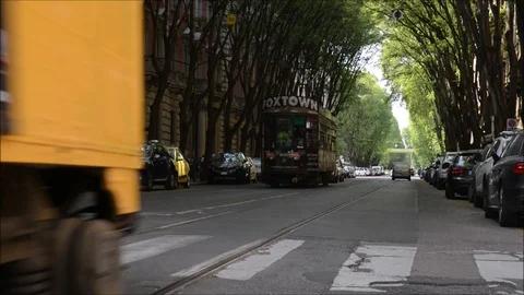 Real time view of traditional electric trams on busy urban street Stock Footage 88902176