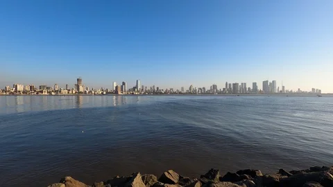 Real time Wide angle footage of beautiful city skyline by the sea, Mumbai, India Stock Footage 124142247