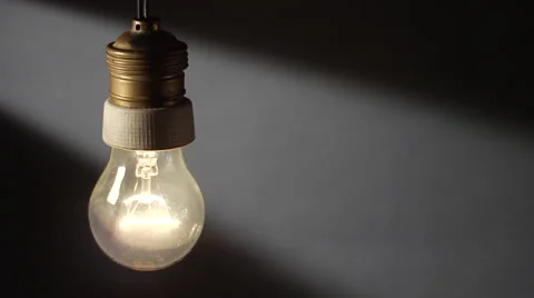 Real tungsten lamp blinks on a window light background Stock Footage 47649396