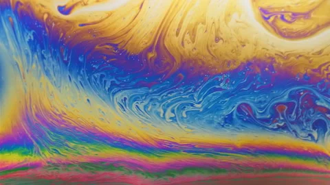 Real video rainbow motion abstract pattern on the surface of the liquid 4K video Видео 96993695