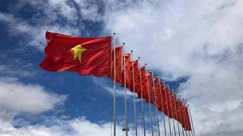 Real Vietnamese flag waving in the wind on flagpole, blue sky sunny day,Vietnam Stock Footage 105741208