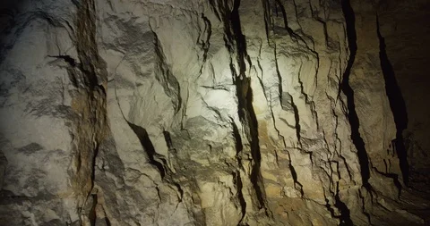 A real wall of rough-hewn stone inside the cave. As if made by gnome miners. Stock Footage 127025933