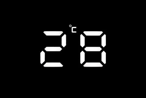 Real white led digital clock on black background Stock Photos