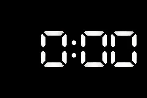 Real white led digital clock on black background Stock Photos