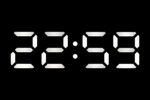 Real white led digital clock on black background Stock Photos