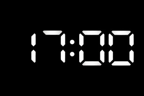 Real white led digital clock on black background Stock Photos