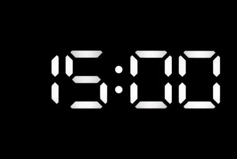 Real white led digital clock on black background Stock Photos
