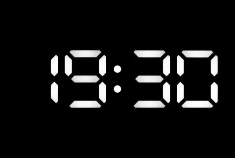 Real white led digital clock on black background Stock Photos
