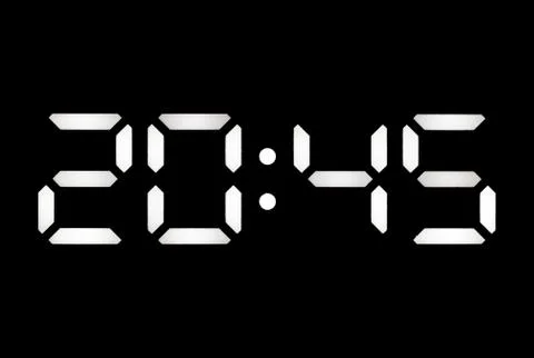 Real white led digital clock on black background Stock Photos