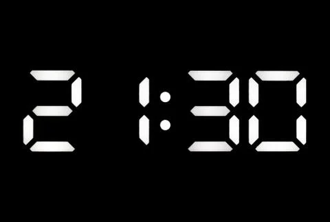 Real white led digital clock on black background Stock Photos