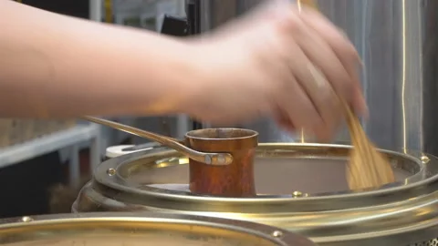 Real  work of a professional Barista for making coffee in cezve Stock Footage 88766600