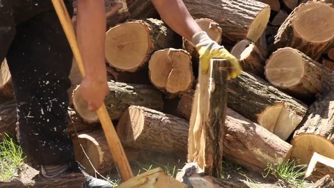Real worker Chopping Firewood with an ax outdoors Stock Footage 90191867