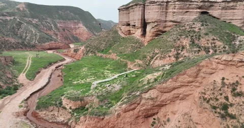 Real-world video: Aerial View Of Danxia Landform Canyon With Dry Riverbed Vídeos de archivo 312919432