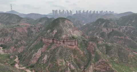 Real-world video: Aerial View Of Danxia Landform Mountains Near City Vídeos de archivo 312929646