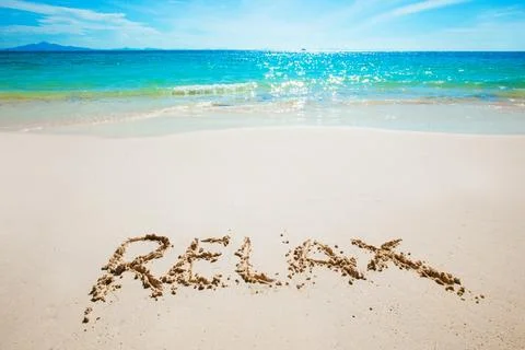 Realax writing on a beach Foto stock