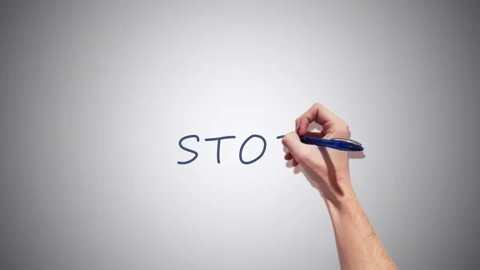 A Realistic 2D had writing Stop with a pen on a white background Video stock 155221281