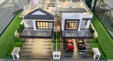 Realistic architectural model of two modern semi‑detached houses Stock Photos