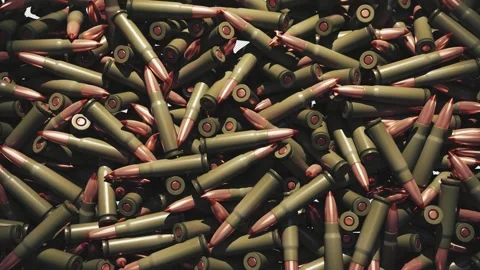 Realistic bullets fall from above, gradually filling the frame. Stock Footage 337035069