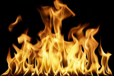 Realistic burning fire flames line isolated on black background Фото