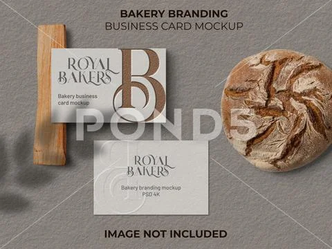 Realistic business cards on light brown texture background besides with bread PSD Template