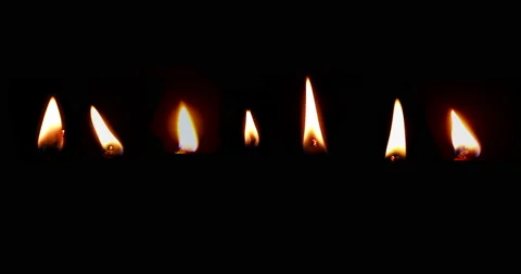 Realistic candle flame isolated against a dark (alpha) background. Stock Footage
