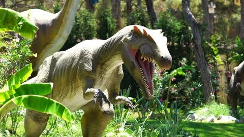 Realistic Dinosaur Model Roaming Through Tall Grass Stock Footage 288128164