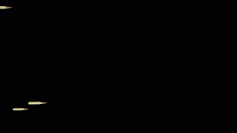 Realistic flying and rotating bullets isolated on black background. Stock Footage 120064055