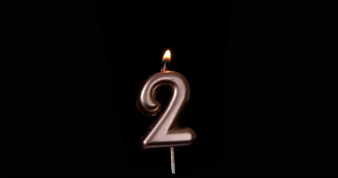 Realistic full-sized single birthday candlelight 2 two number isolated on black  Stock Footage 142744541