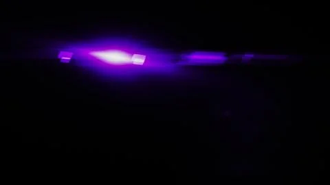 Realistic Len flare glow light effect on black background. Optical flares ove Stock Illustration