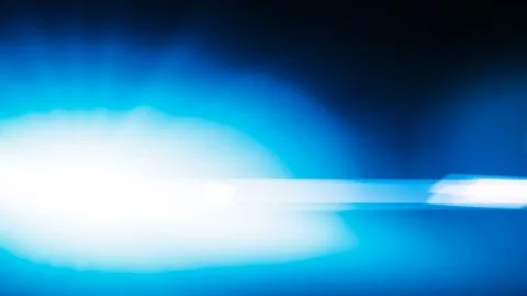 Realistic Len flare glow light effect on black background. Optical flares ove Stock Illustration
