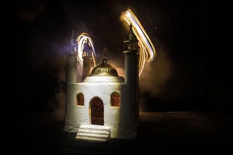 A realistic Mosque miniature with windows at night. Festive greeting card, in Stock-Illustration