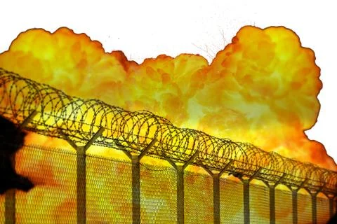 Realistic orange fire explosion behind restricted area barbed wire fence isol Stock Photos