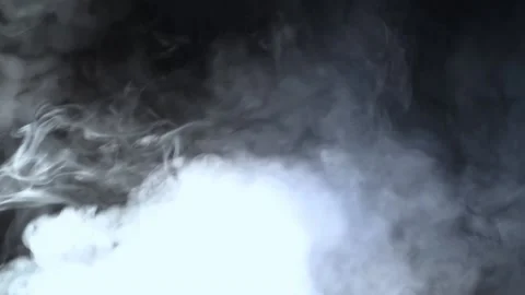 Realistic smoke clouds in a beam of a flashlight on a black background. Stock Footage 161009685