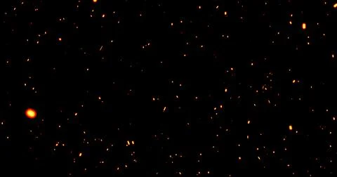 Realistic surreal ember fire dust slowing rising up on black bg. Grunge dar.. Stock Illustration