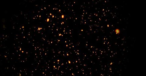 Realistic surreal ember fire dust slowing rising up on black bg. Grunge dar.. Stock Illustration