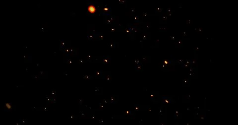 Realistic surreal ember fire dust slowing rising up on black bg. Grunge dar.. Stock Illustration